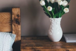 bedside table with vase staging