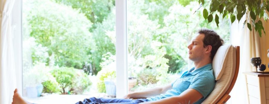 man relaxing in home - wellness
